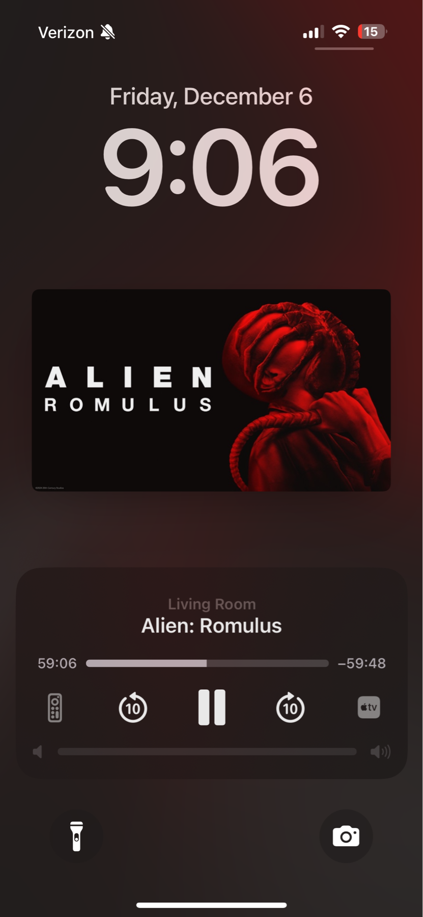 Smartphone lock screen showing the time as 9:06 and date as Friday, December 6. “Alien: Romulus” is playing in the media widget for the Living Room, with 59:06 elapsed minutes 