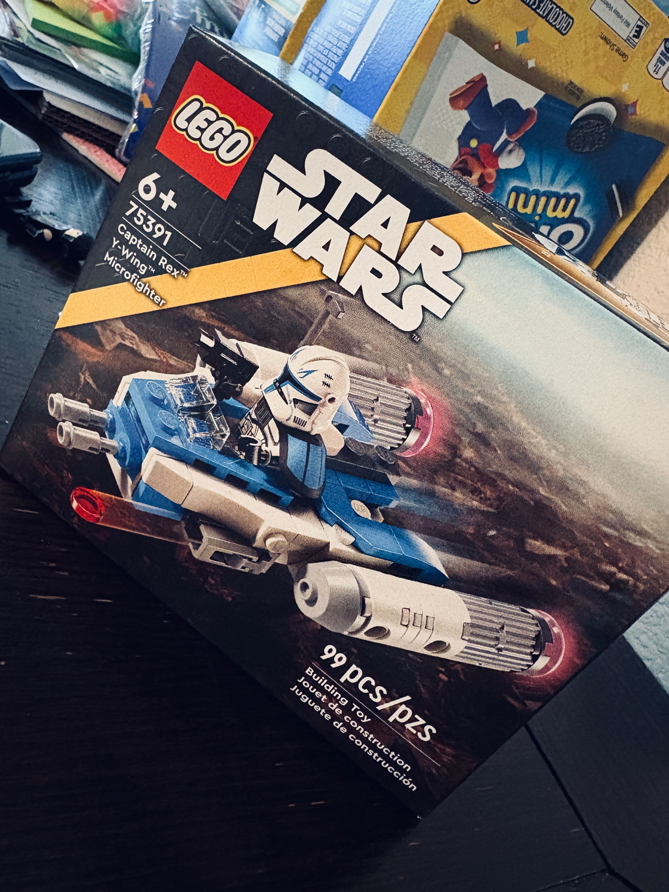 LEGO Star Wars set featuring Captain Rex’s Y-Wing Microfighter. The box shows the toy’s design and includes 99 pieces, suitable for ages 6 and up.